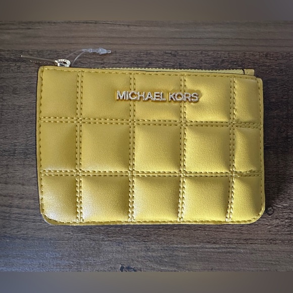 Michael Kors Handbags - Michael Kors Quilted Jet Set Travel Wallet w/Zip Coin Pouch. Daisy Yellow. NWT.